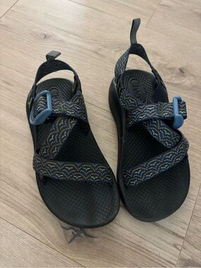 Chaco navy sport sandals with yellow-green pattern and blue buckles